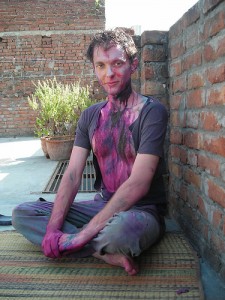 Lane with shirt torn, covered in dye